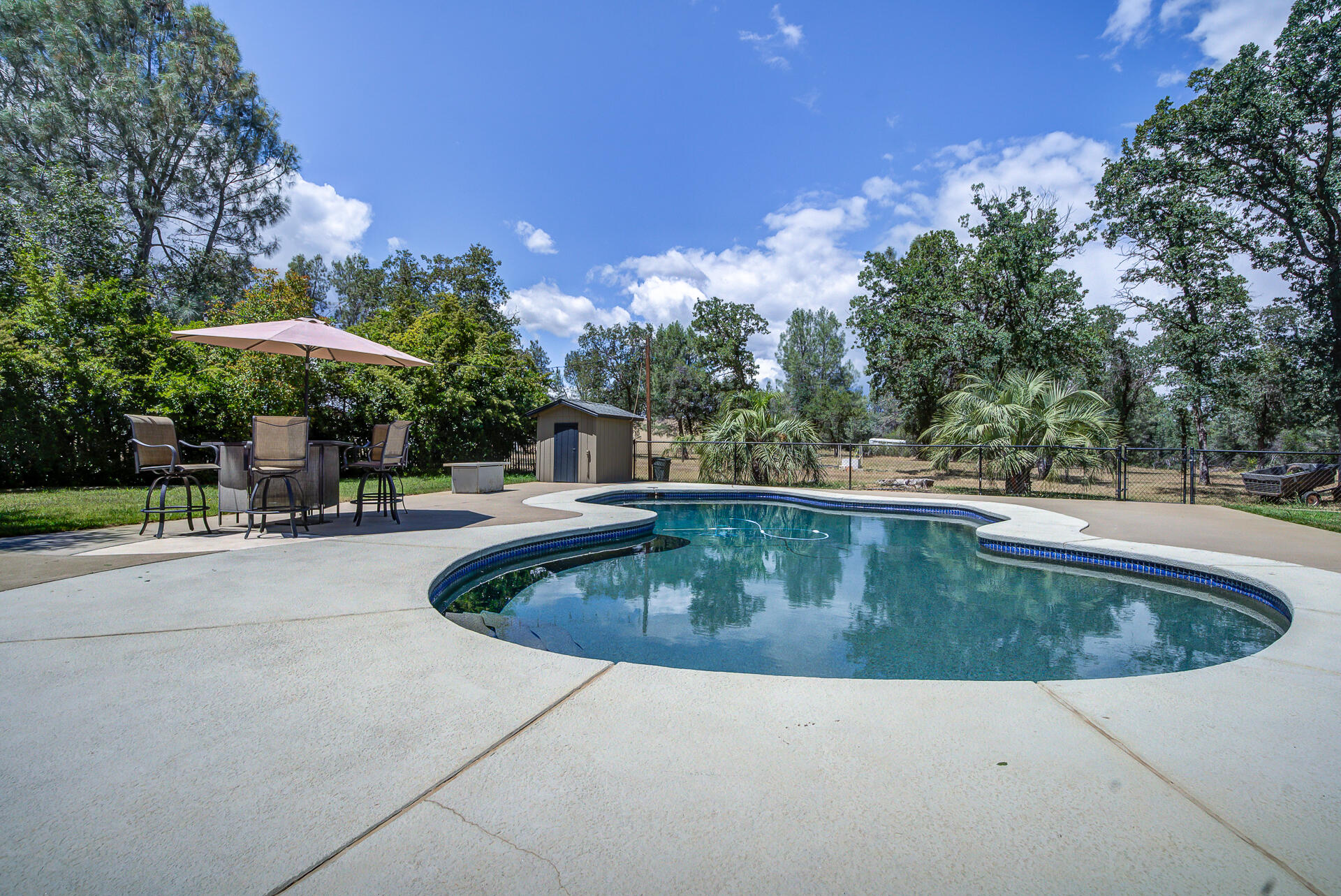 17536 Oly Way Anderson, CA 96007 - Photo 36 of 51 a view of outdoor space yard swimming pool and patio