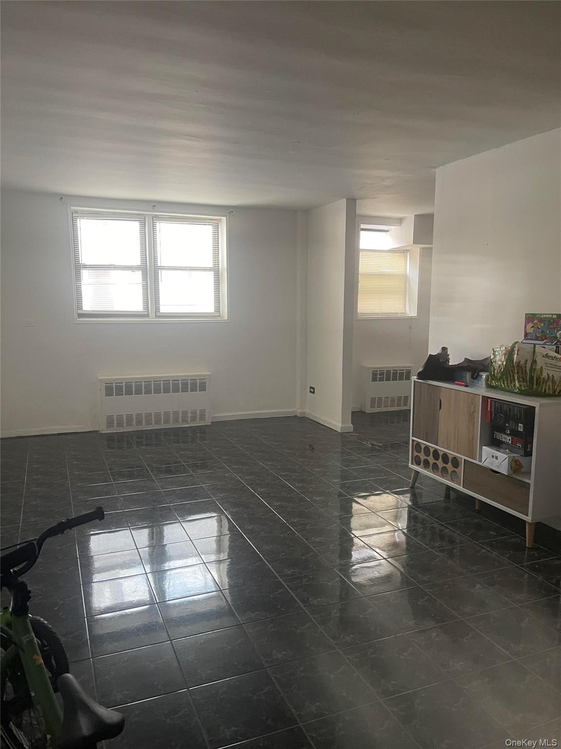 152-72 Melbourne Avenue, Unit LD Queens, NY 11367 - Photo 4 of 10 a living room with furniture and a window