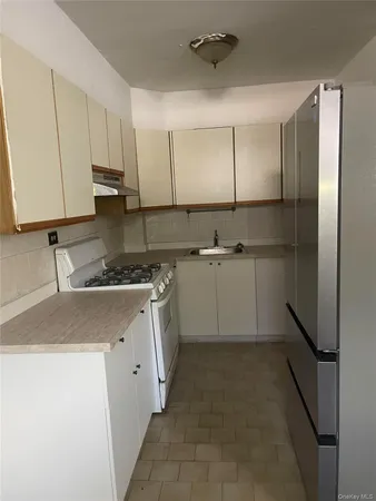 a bathroom with a sink and mirror
