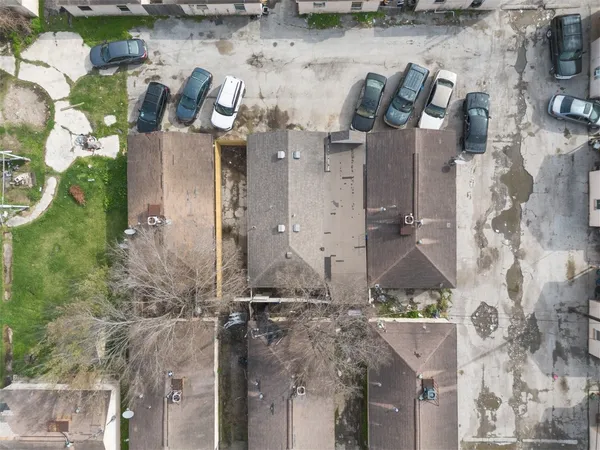 an aerial view of houses with outdoor space