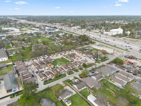 an aerial view of residential houses with outdoor space