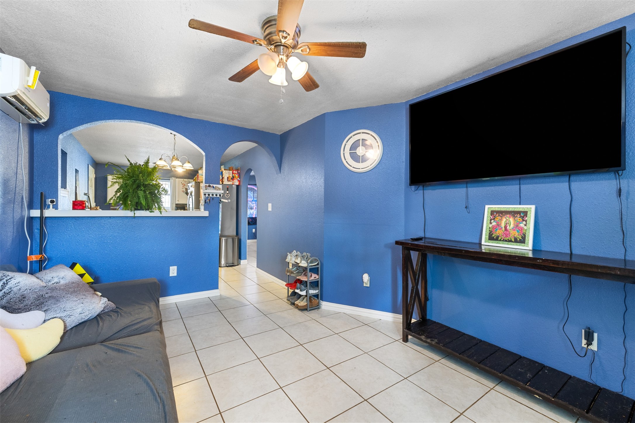 3367 Sadler Street Houston, TX 77093 - Photo 24 of 25 a bedroom with a bed and a flat screen tv