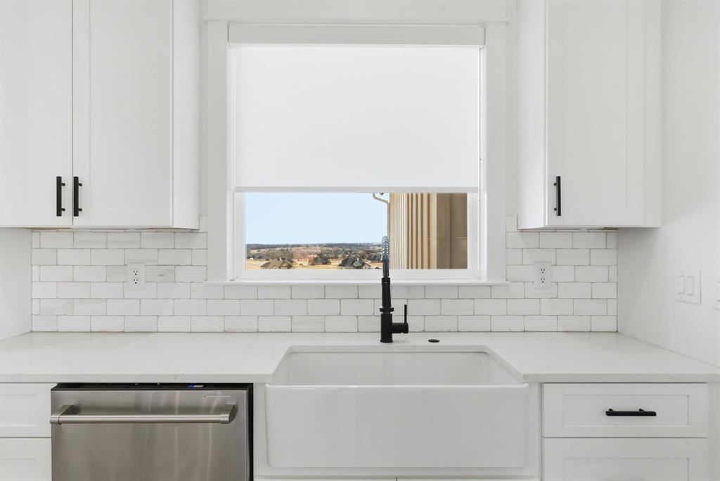 1024 Agnes North Springtown, TX 76082 - Photo 15 of 36 a bathroom with a sink and a window