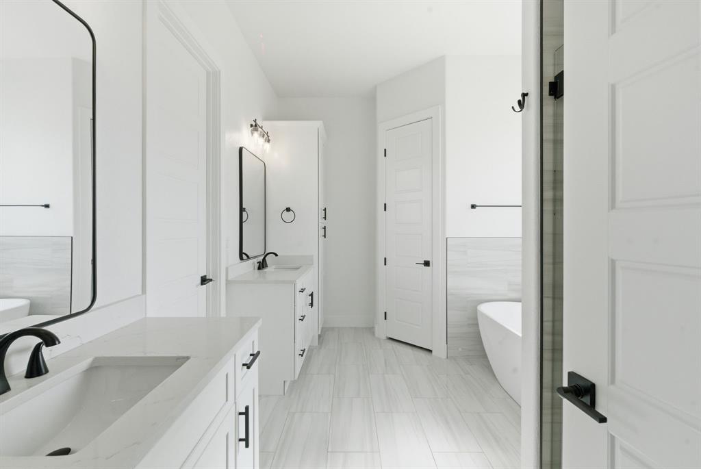 1024 Agnes North Springtown, TX 76082 - Photo 20 of 36 a bathroom with a sink a toilet and shower