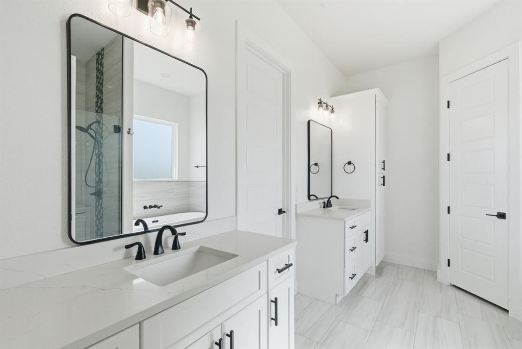 1024 Agnes North Springtown, TX 76082 - Photo 21 of 36 a bathroom with a double vanity sink mirror and