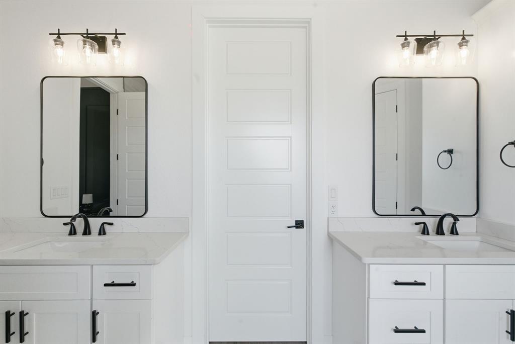 1024 Agnes North Springtown, TX 76082 - Photo 24 of 36 a bathroom with a sink and a mirror