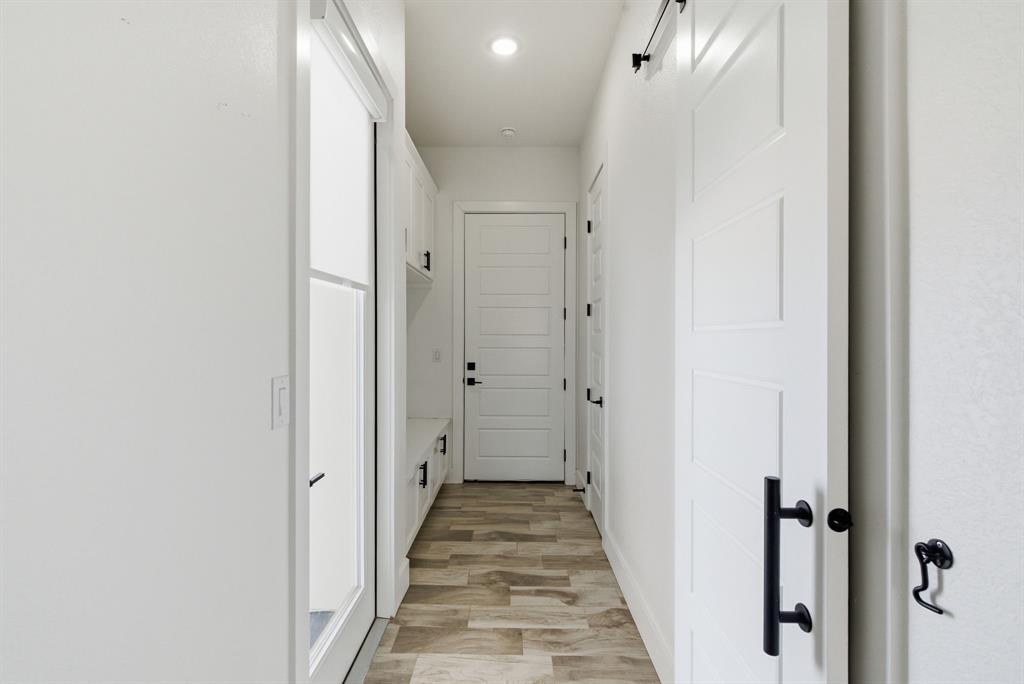 1024 Agnes North Springtown, TX 76082 - Photo 31 of 36 a view of a bathroom from the hallway