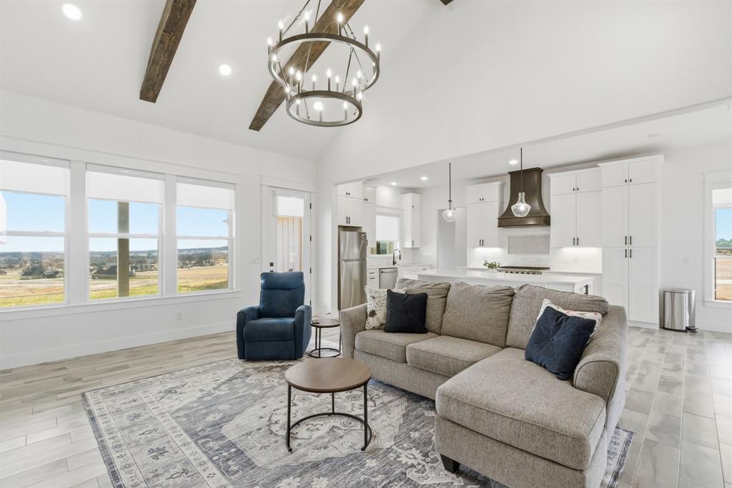 1024 Agnes North Springtown, TX 76082 - Photo 8 of 36 a living room with furniture and a large window
