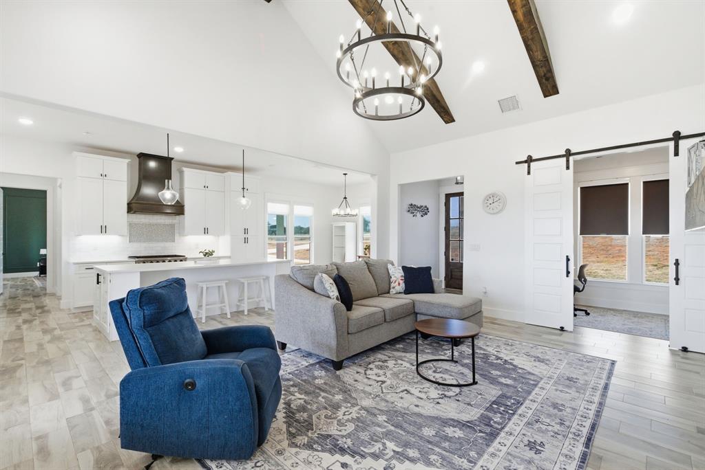 1024 Agnes North Springtown, TX 76082 - Photo 9 of 36 a living room with furniture and kitchen view