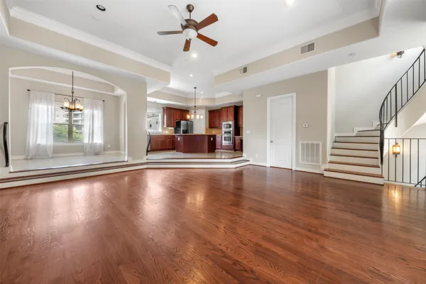 a view of a livingroom with hardwood floor and a ceiling fan