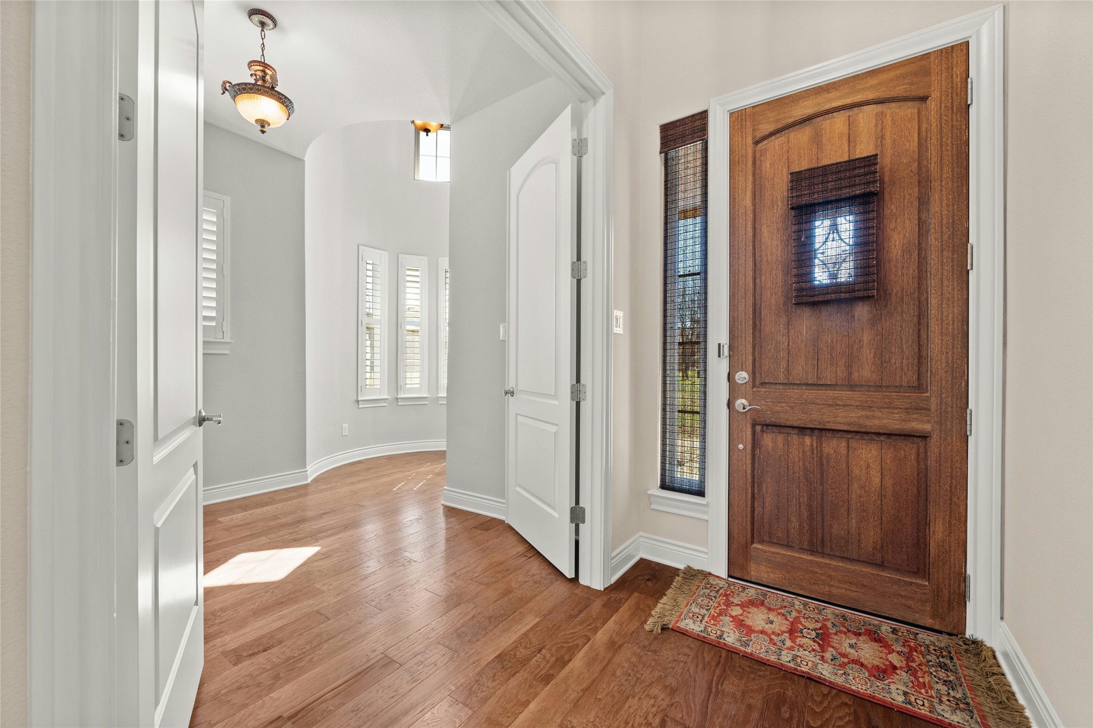 103 Rivalto Circle, Unit 3 Lakeway, TX 78734 - Photo 20 of 30 a view of an entryway with wooden floor