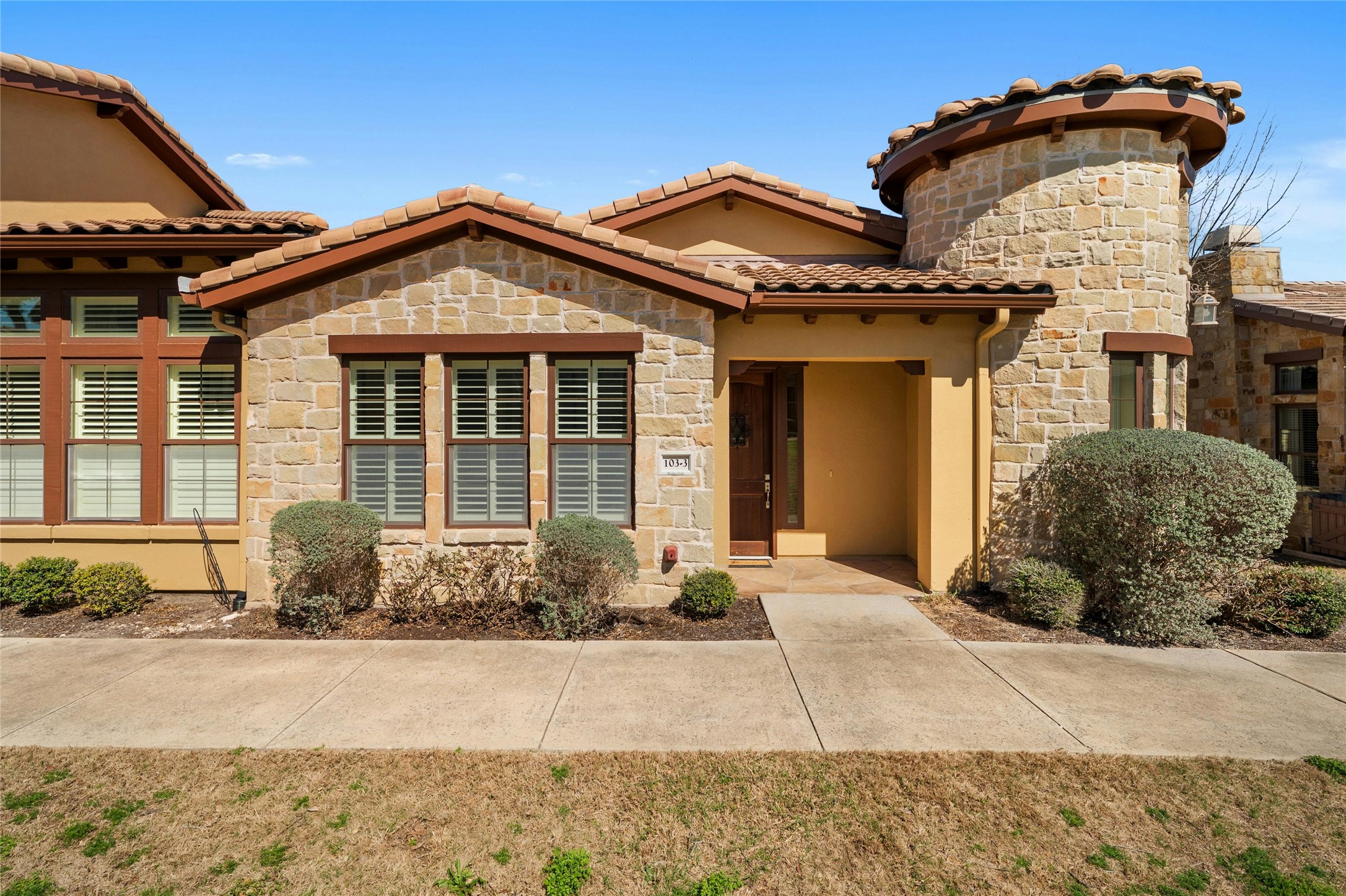 103 Rivalto Circle, Unit 3 Lakeway, TX 78734 - Photo 2 of 30 a front view of a house