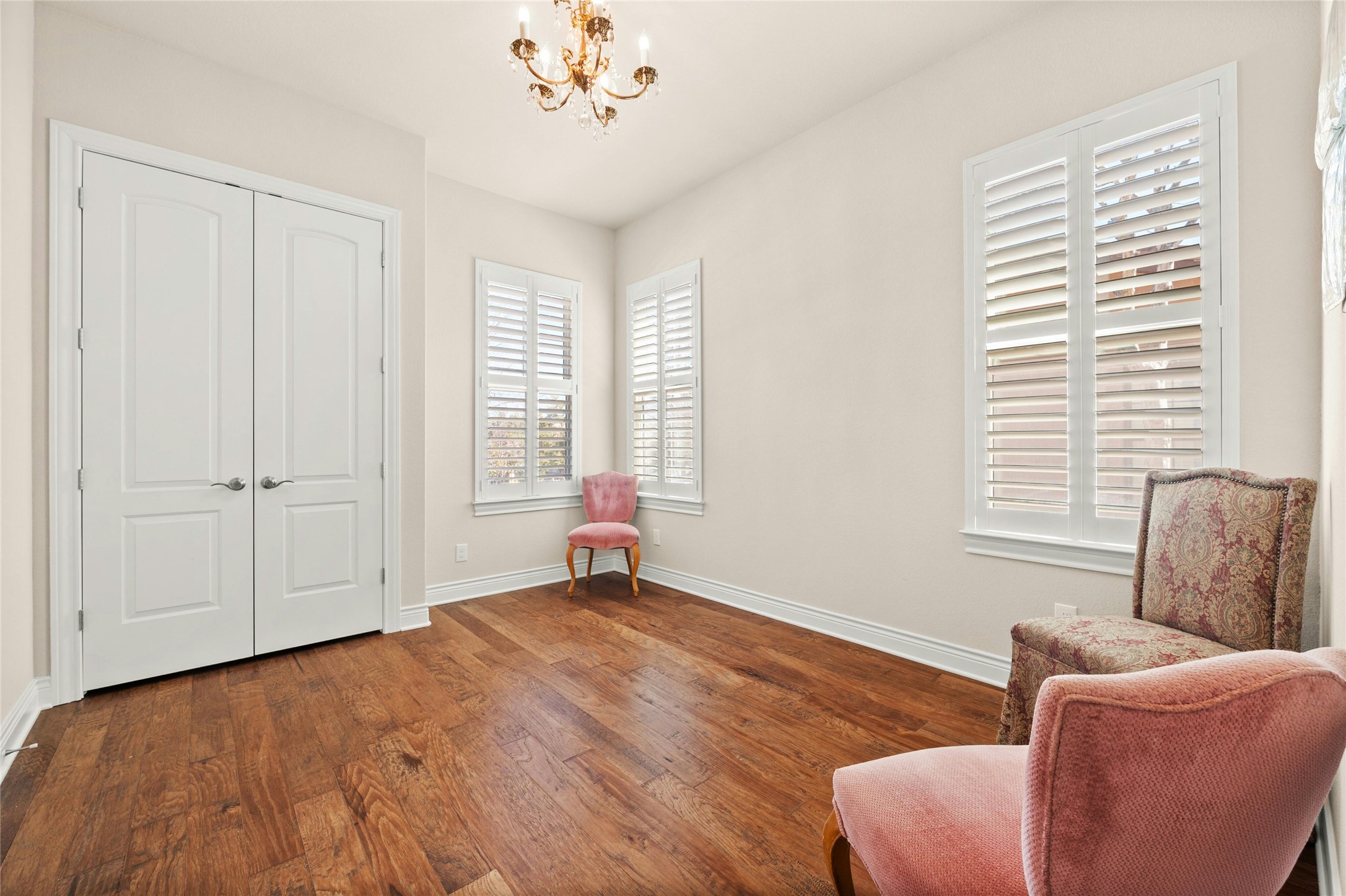 103 Rivalto Circle, Unit 3 Lakeway, TX 78734 - Photo 21 of 30 a bedroom with furniture and a window