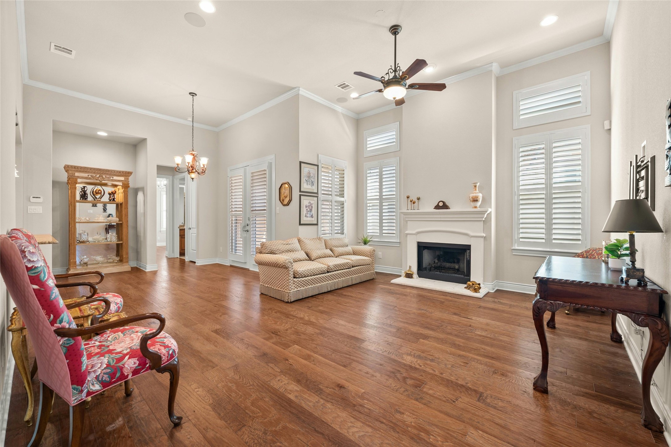 103 Rivalto Circle, Unit 3 Lakeway, TX 78734 - Photo 4 of 30 a living room with furniture a fireplace and a table