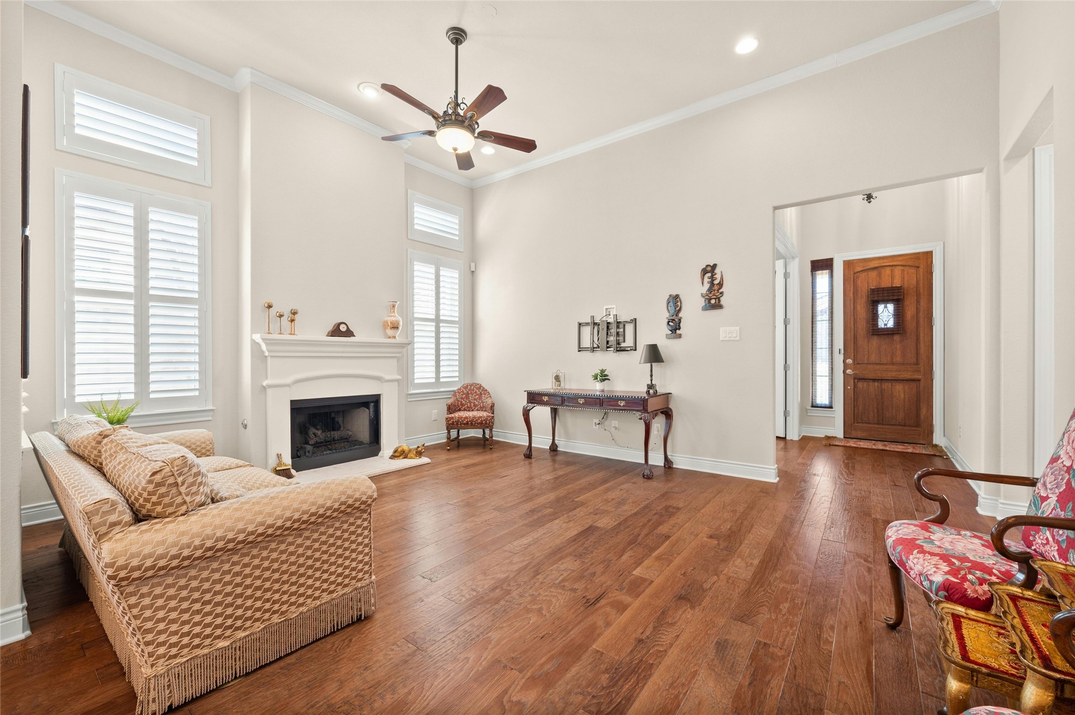 103 Rivalto Circle, Unit 3 Lakeway, TX 78734 - Photo 5 of 30 a living room with furniture and a fireplace