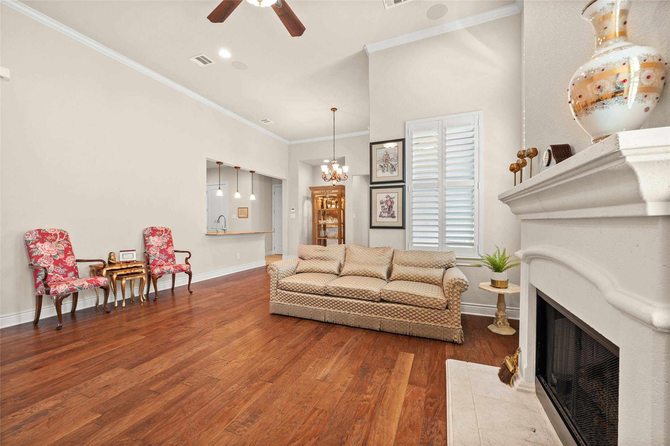 103 Rivalto Circle, Unit 3 Lakeway, TX 78734 - Photo 6 of 30 a living room with furniture and a fireplace