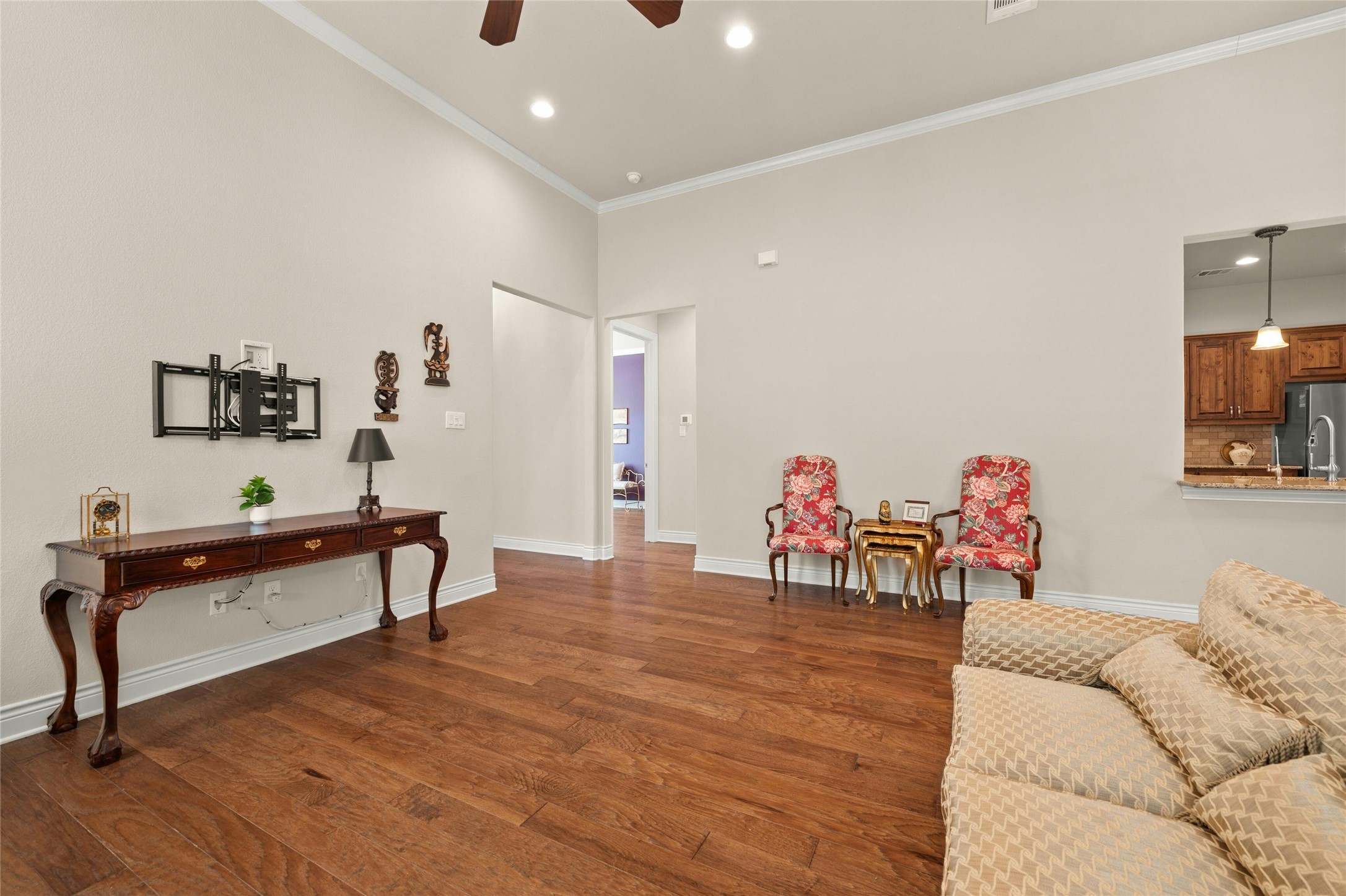 103 Rivalto Circle, Unit 3 Lakeway, TX 78734 - Photo 7 of 30 a living room with furniture and a wooden floor