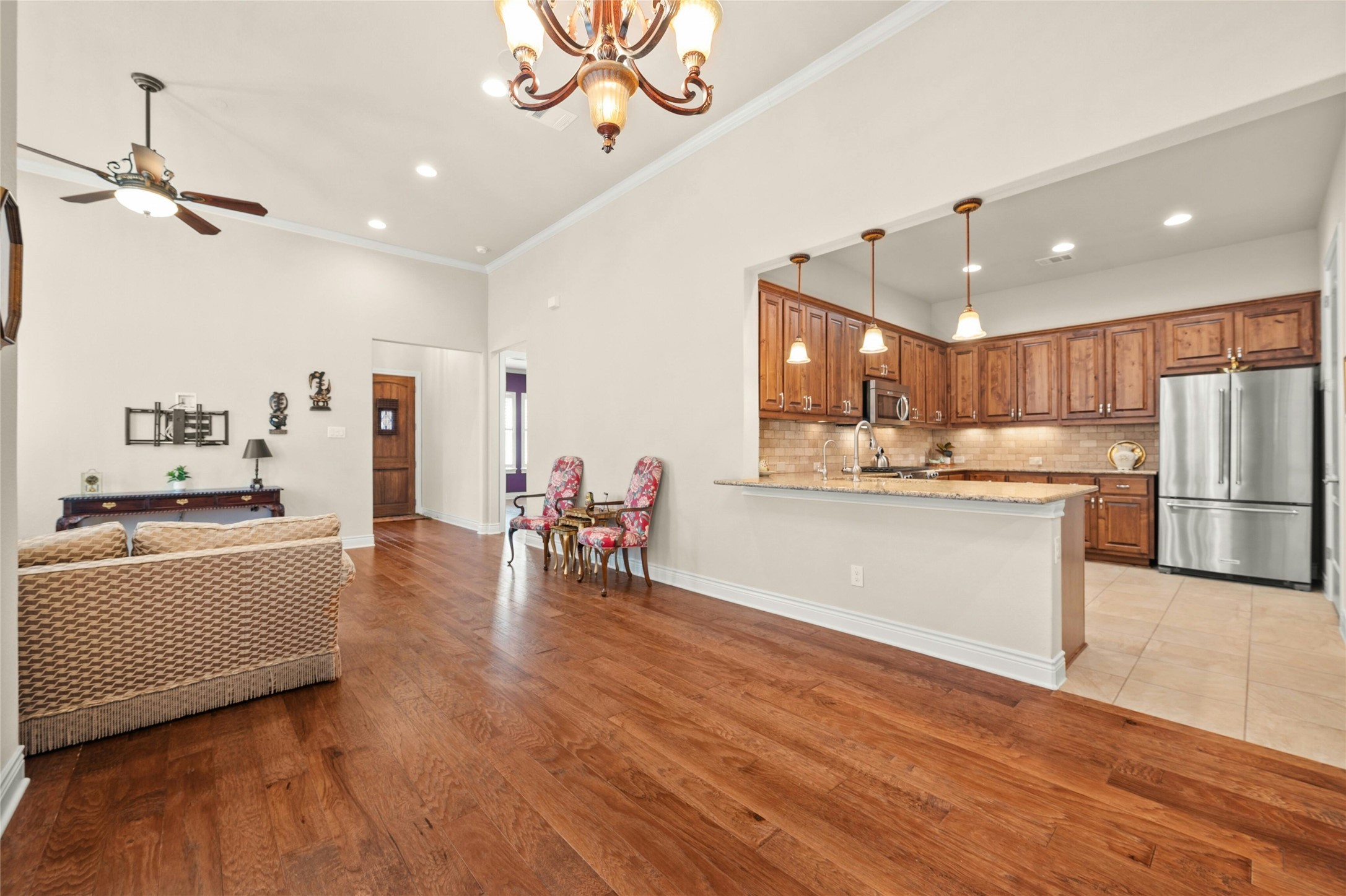 103 Rivalto Circle, Unit 3 Lakeway, TX 78734 - Photo 8 of 30 a large white kitchen with a large window stainless steel appliances and cabinets