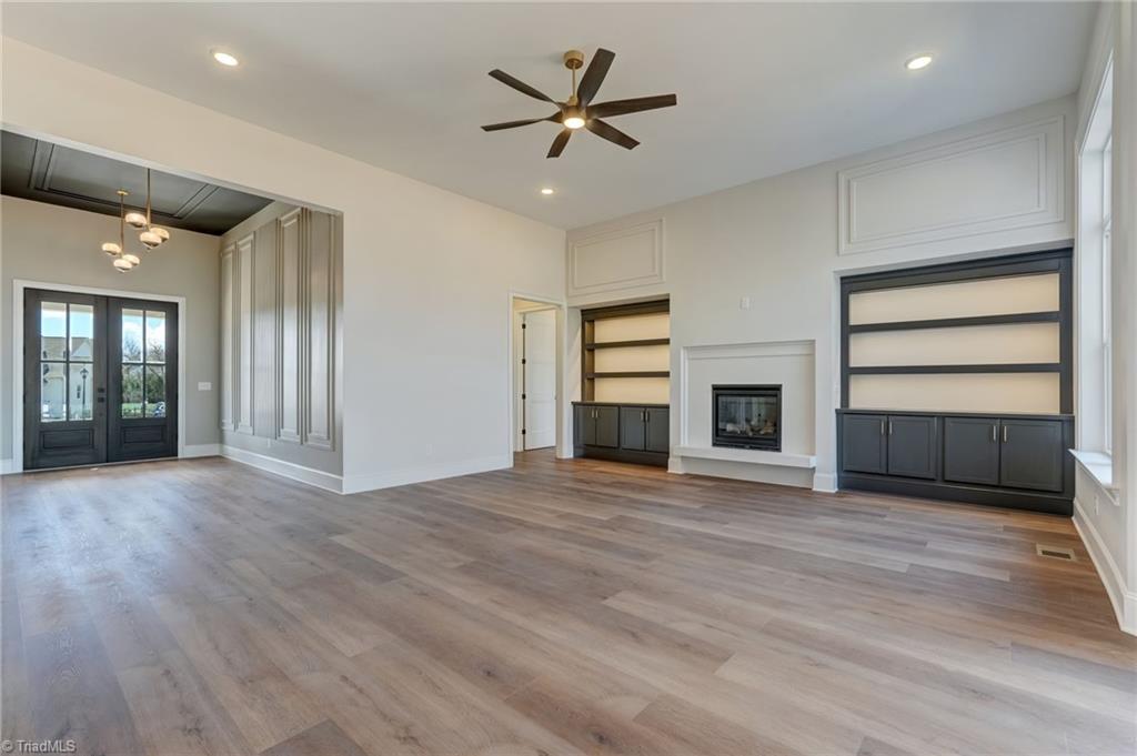 7688 Kyran Court Oak Ridge, NC 27310 - Photo 8 of 40 View from the dining room into great room