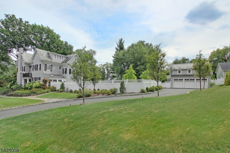 a view of a house with a yard and sitting area