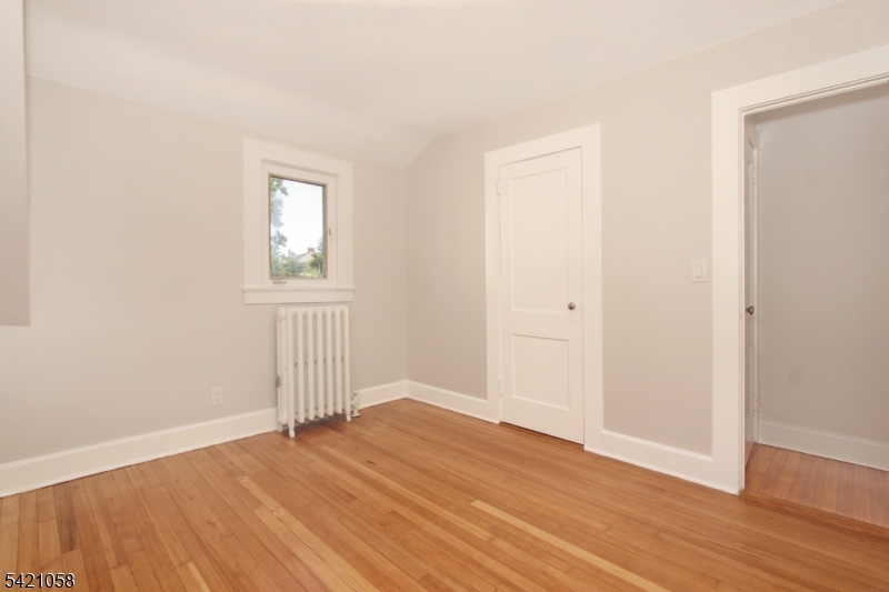 10 Lincoln Street Glen Ridge, NJ 07028 - Photo 16 of 28 an empty room with wooden floor