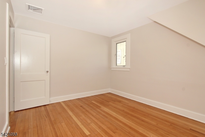 10 Lincoln Street Glen Ridge, NJ 07028 - Photo 18 of 28 wooden floor in an empty room