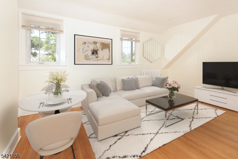 10 Lincoln Street Glen Ridge, NJ 07028 - Photo 2 of 28 a living room with furniture and a flat screen tv