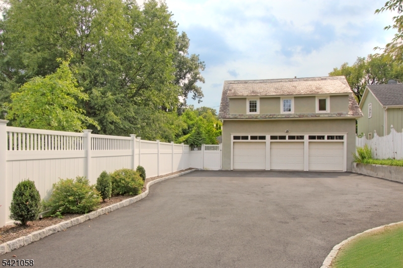 10 Lincoln Street Glen Ridge, NJ 07028 - Photo 23 of 28 a front view of a house with a yard and garage