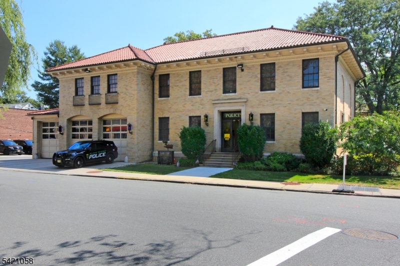 10 Lincoln Street Glen Ridge, NJ 07028 - Photo 24 of 28 a front view of a house with a yard and garage