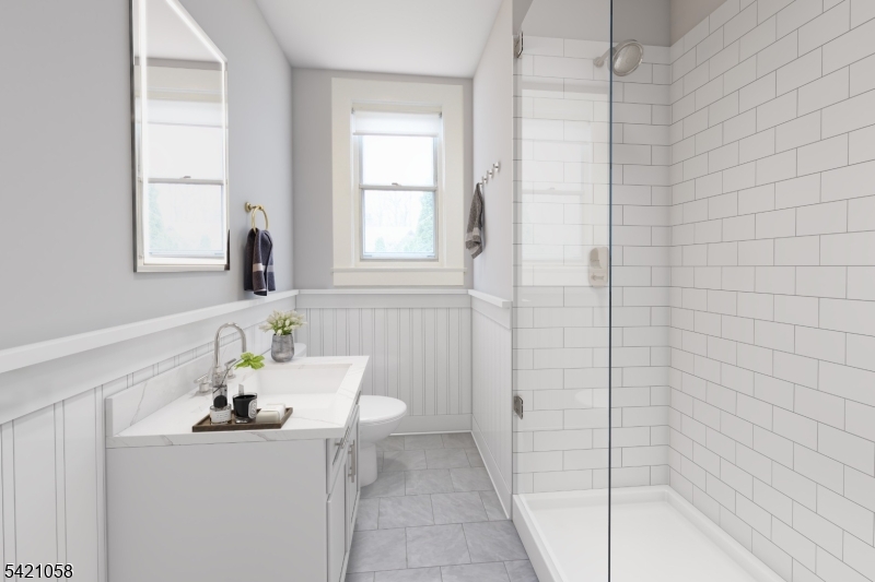 10 Lincoln Street Glen Ridge, NJ 07028 - Photo 6 of 28 a bathroom with a sink a toilet and shower