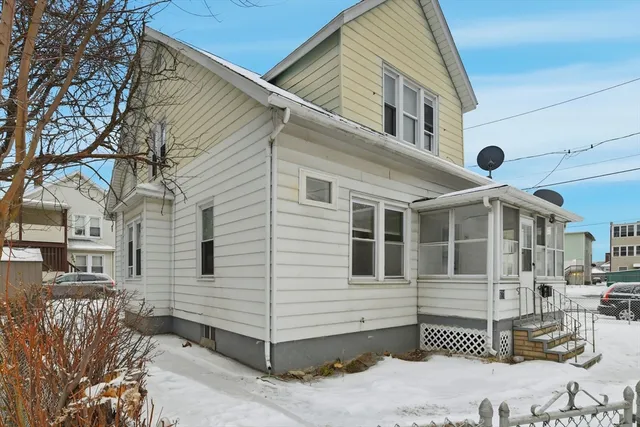 a front view of a house with a porch