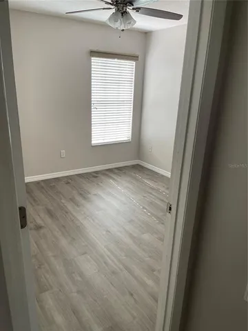 an empty room with wooden floor