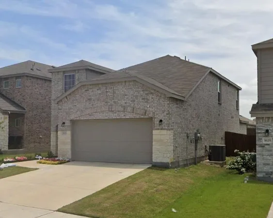 a front view of a house with a garage