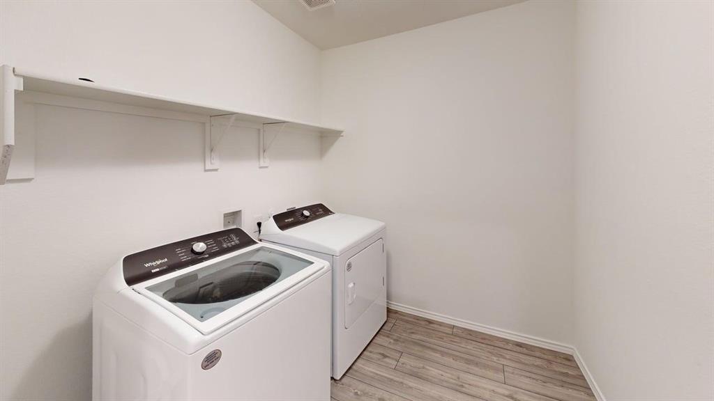 1623 Box Elder Road Forney, TX 75126 - Photo 20 of 22 a utility room with dryer and washer