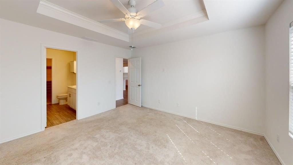 1623 Box Elder Road Forney, TX 75126 - Photo 9 of 22 a view of a big room with closet and a ceiling fan