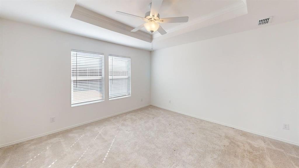 1623 Box Elder Road Forney, TX 75126 - Photo 10 of 22 an empty room with a window and a fan