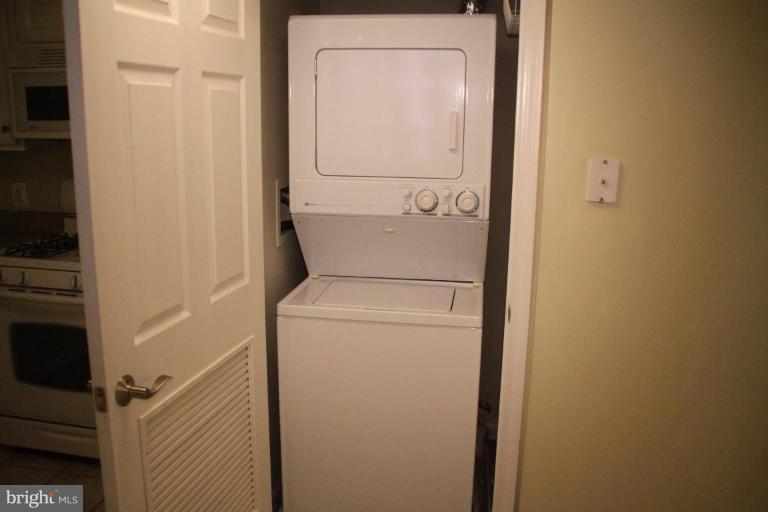 11710 Old Georgetown Road, Unit 824 Rockville, MD 20852 - Photo 11 of 12 a utility room with dryer and washer