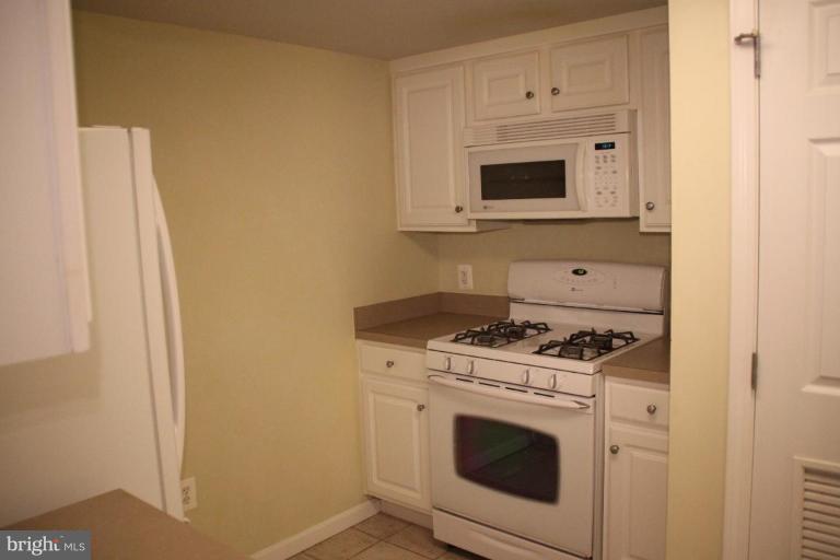 11710 Old Georgetown Road, Unit 824 Rockville, MD 20852 - Photo 3 of 12 a view of a storage and utility room with washer and dryer
