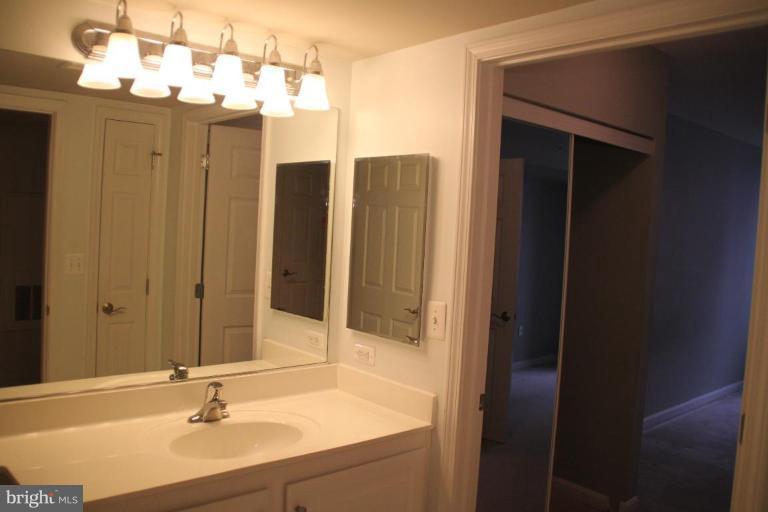 11710 Old Georgetown Road, Unit 824 Rockville, MD 20852 - Photo 6 of 12 a bathroom with a sink tub and shower
