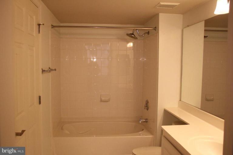 11710 Old Georgetown Road, Unit 824 Rockville, MD 20852 - Photo 8 of 12 a bathroom with a shower and a bath tub