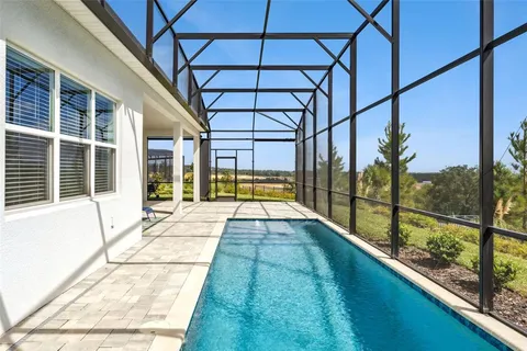 a view of a swimming pool with a porch