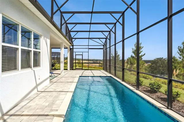 a view of a swimming pool with a porch