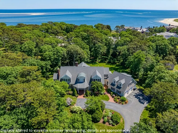 an aerial view of a house with a garden