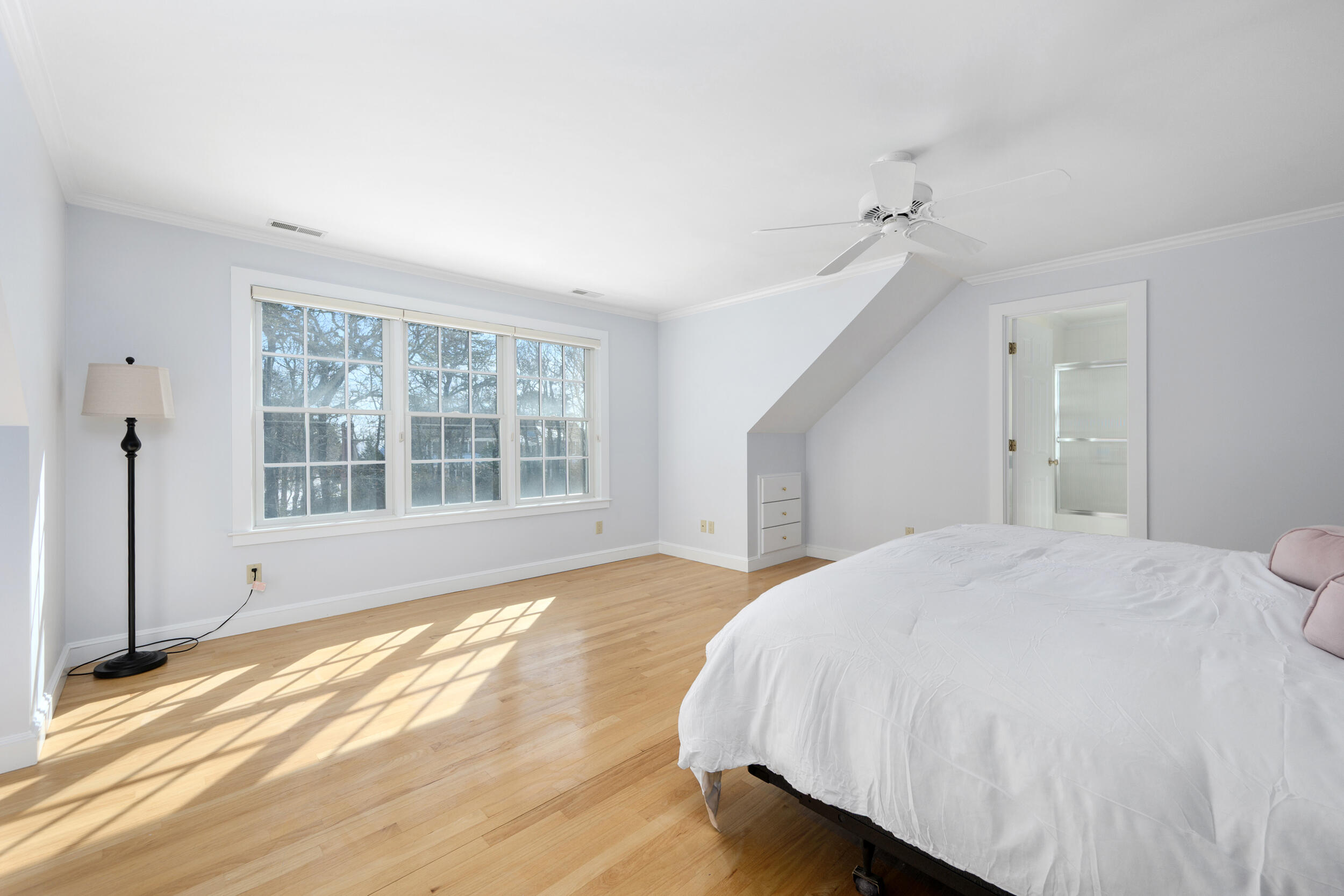 169 Tisquantum Road Chatham, MA 02633 - Photo 27 of 43 a spacious bedroom with a bed and a window