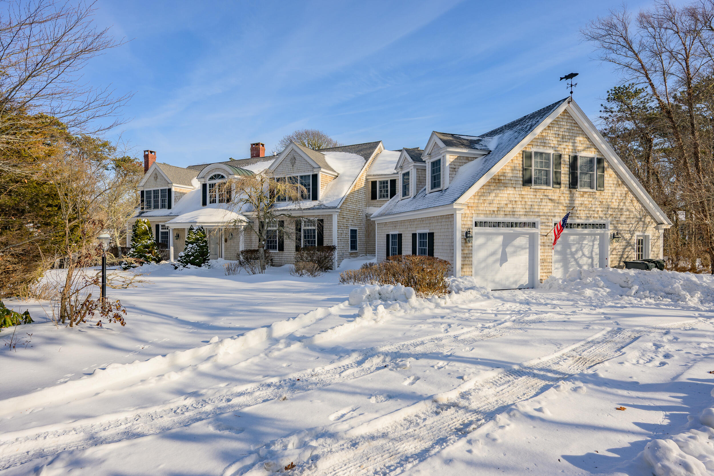 169 Tisquantum Road Chatham, MA 02633 - Photo 4 of 43 a view of a white house with a yard