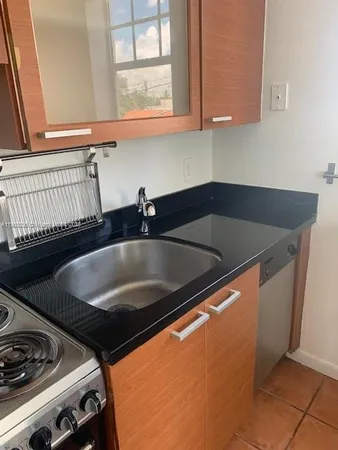 a kitchen with table and chairs