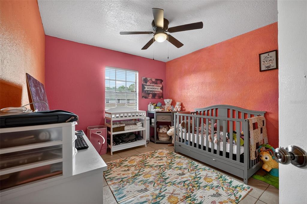 1644 Ruth Street Cocoa, FL 32926 - Photo 16 of 38 a bedroom with furniture and a window