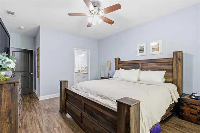 a spacious bathroom with a granite countertop sink a mirror and a