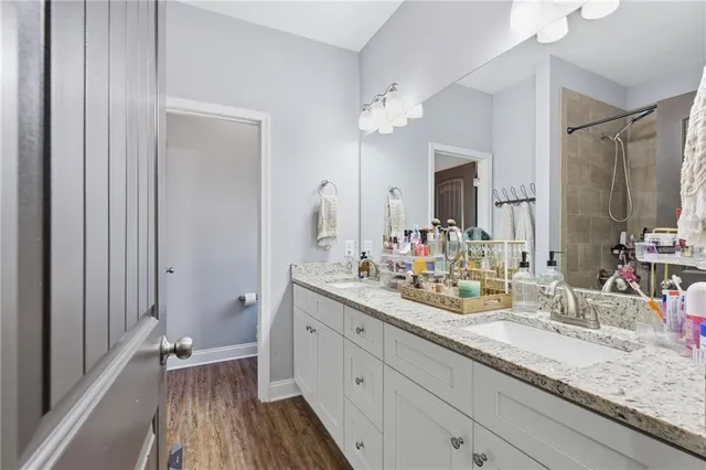a bedroom with a bed and a window with exposed radiator