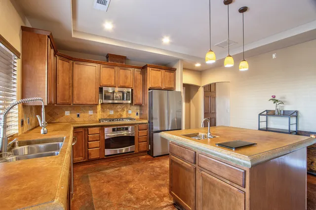 a kitchen that has a lot of cabinets in it
